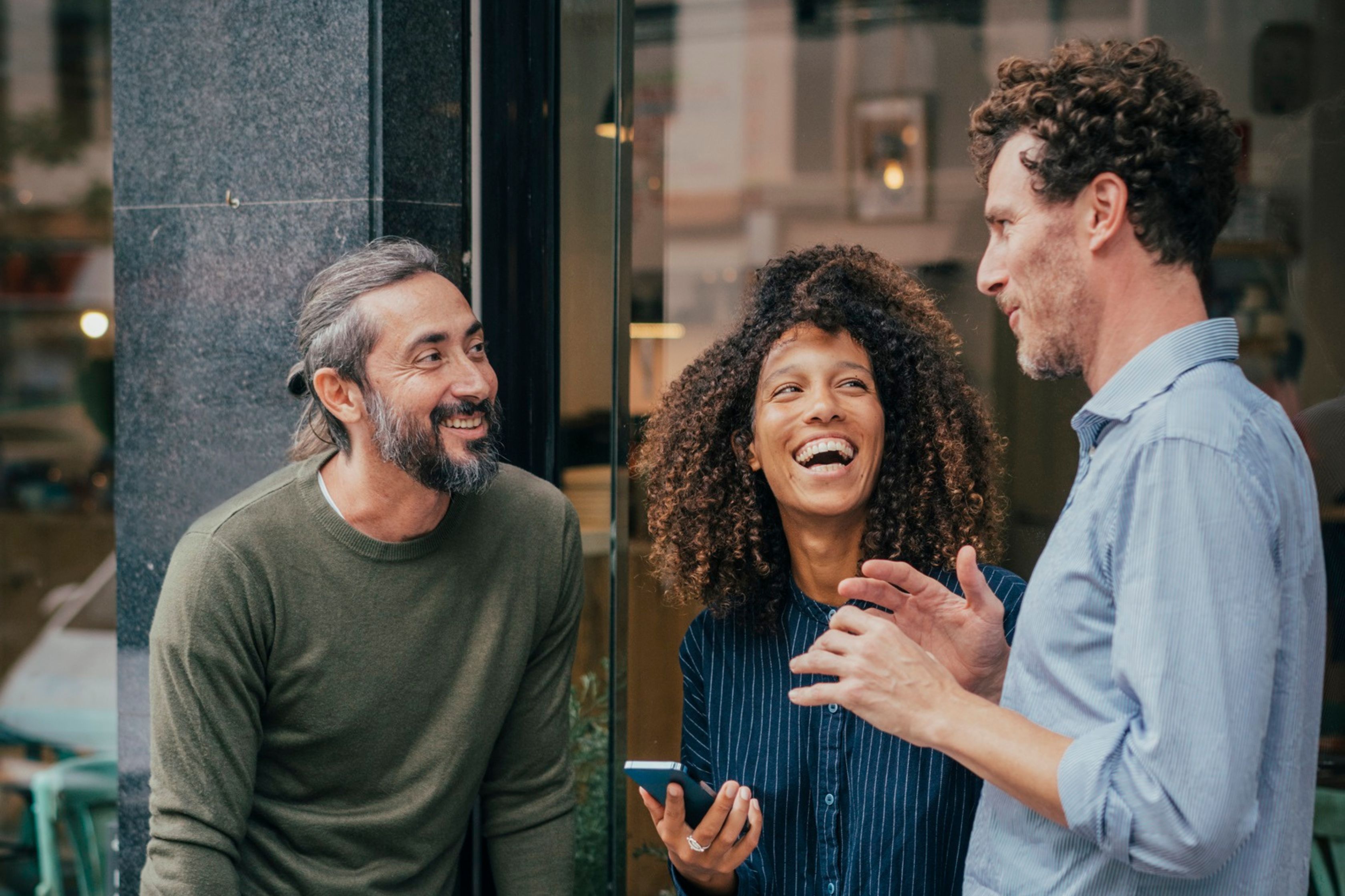 three people chatting