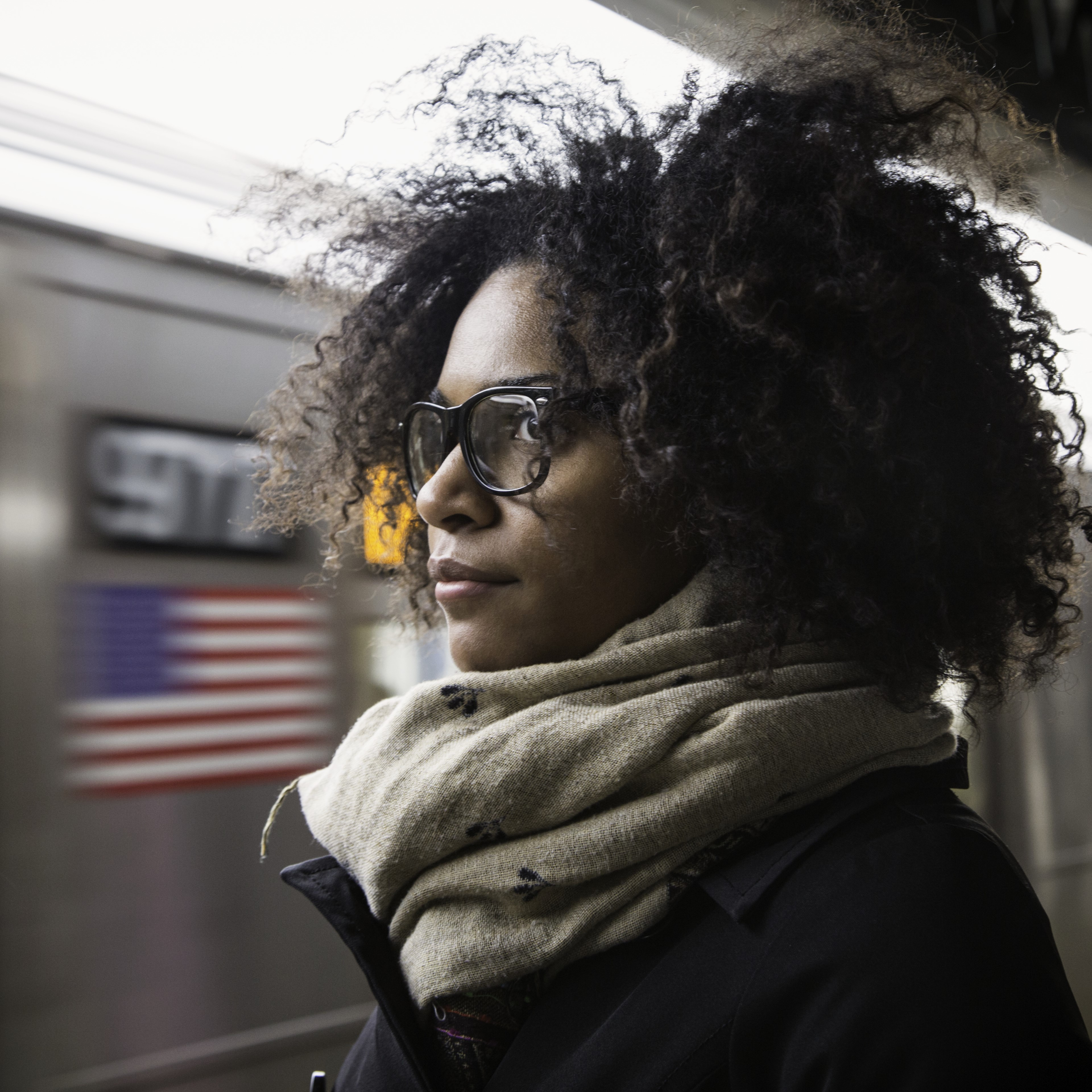 Woman with glasses in the metro